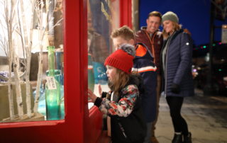 Family Window Shopping on a Winter Evening on Main Street Park City, Utah