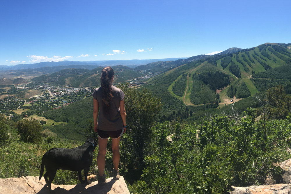 Girl and Dog Looking at Mountains in Park City
