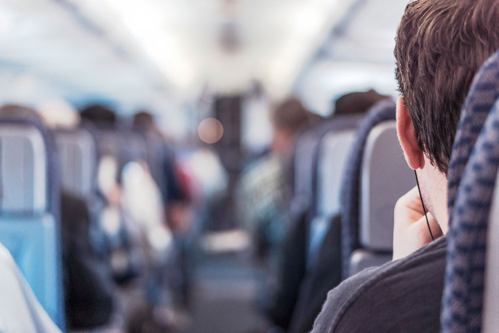 Man in Seat on Plane