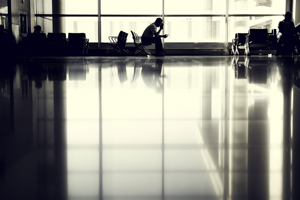 Man Waiting to Board Plane in Airport