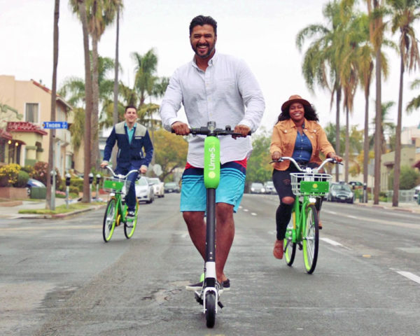 Friends using limebike in San Diego streets