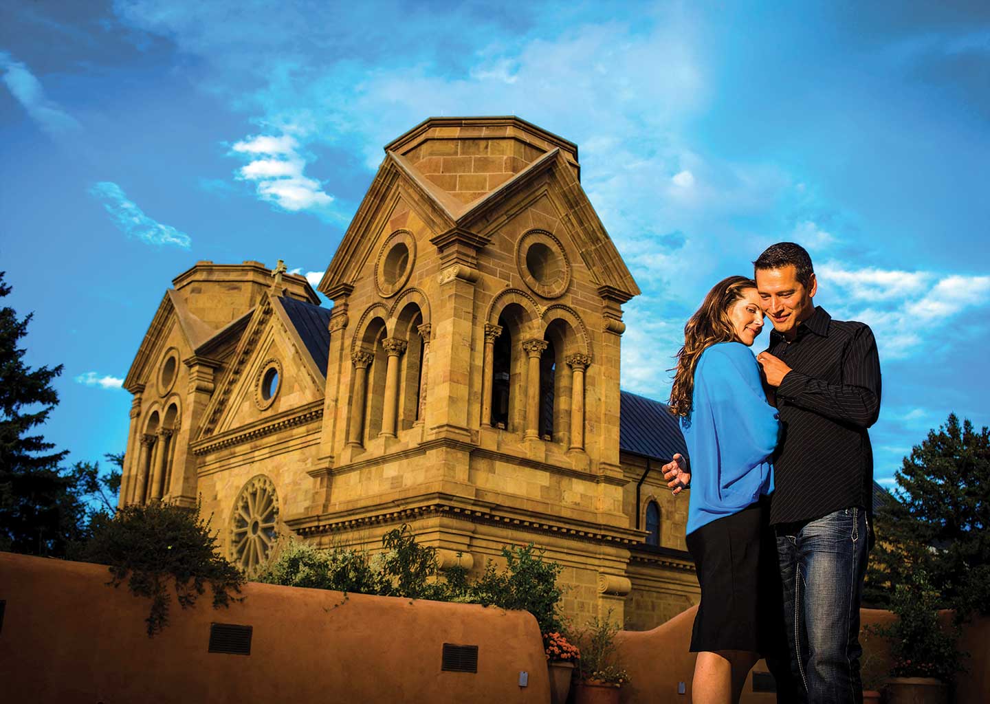 Couple Embracing in front of The Cathedral Basilica of St. Francis of Assisi