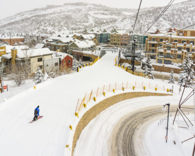 Solo Skier on Town Lift Run Towards Main Street in Park City, Utah