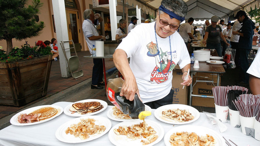 Pouring syrup on Santa Fe pancakes on the plaza