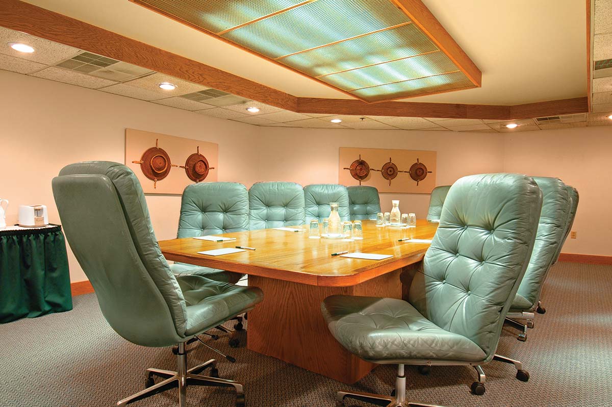 green swivel chairs in an executive meeting room in silver king park city