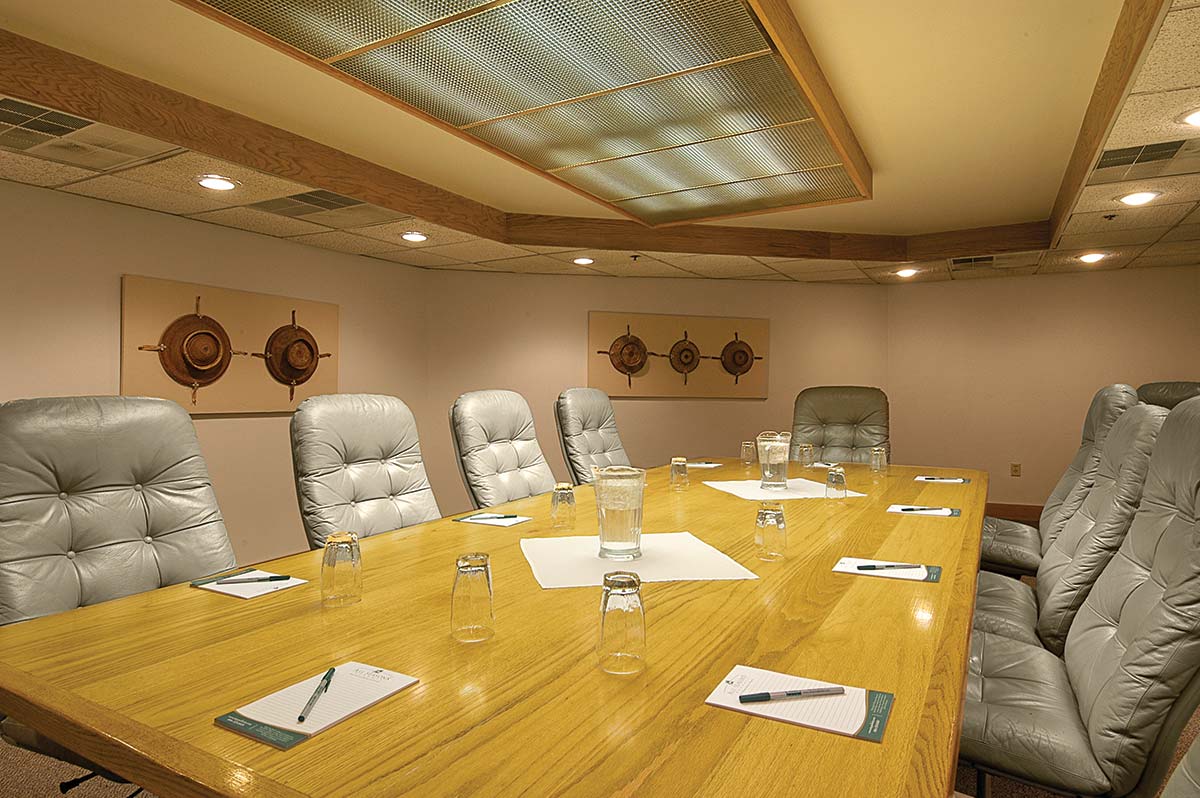 grey swivel chairs around a long executive table in a meeting room in park city