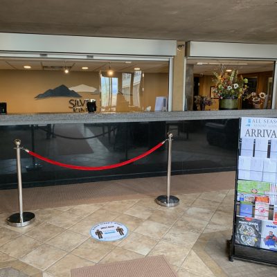 Silver King Hotel's New Front Desk Setup for COVID-19 Safety - Velvet Ropes, Touch-Free Check-In, and Acrylic Barriers