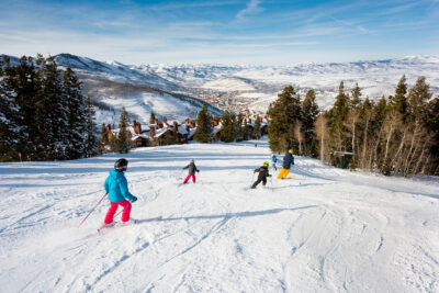 Skiing at Deer Valley Resort Skiers on a Groomed Run in Park City Utah