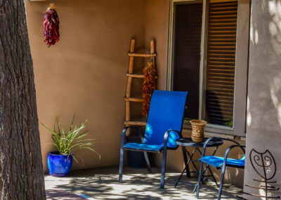 Blue Chairs on a Patio with Dried Peppers in Santa Fe, NM