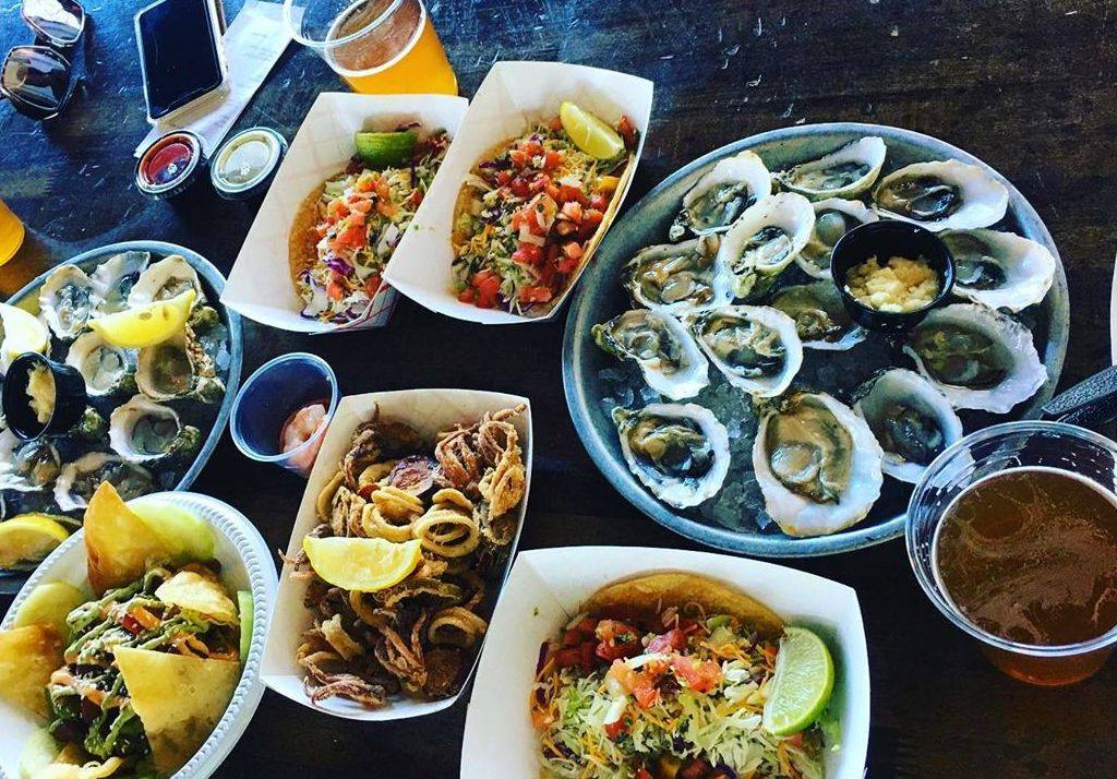 Pacific Beach Fish Shop Oyster Plate Surrounded by Tasty Appetizers in San Diego