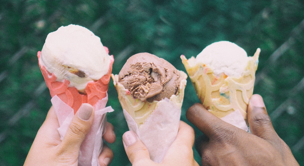 Three Hands Holding Ice Cream Cones