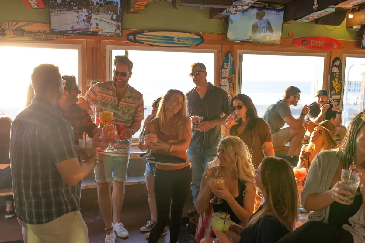 A Group of People Drinking Fancy Drinks at PB Shore Club in Pacific Beach