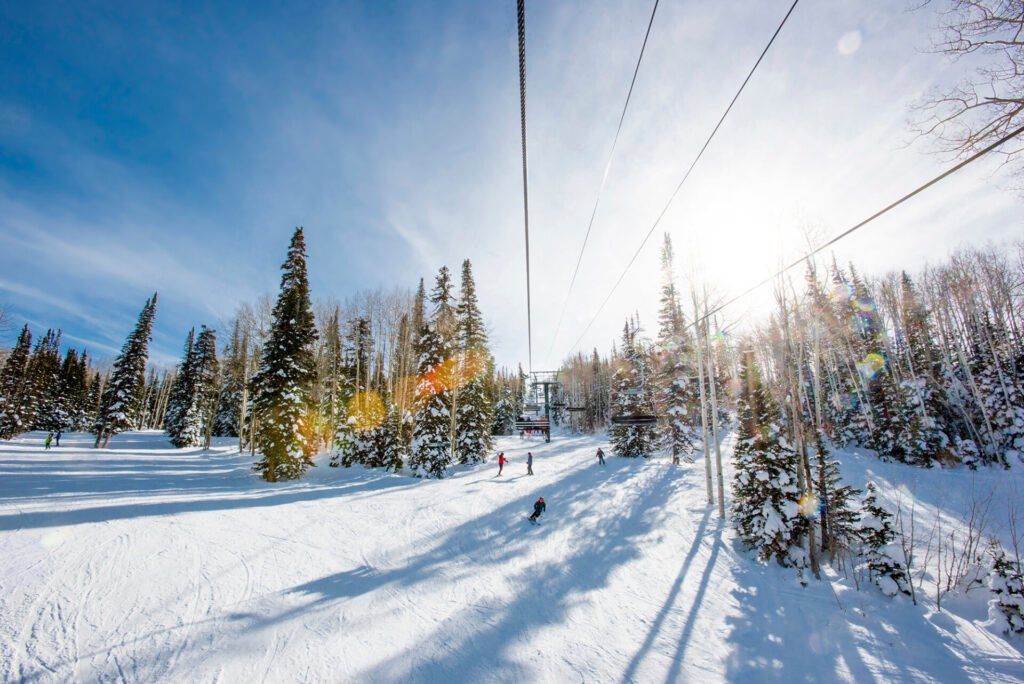 Skiers on a Run at Deer Valley, in Park City, Utah