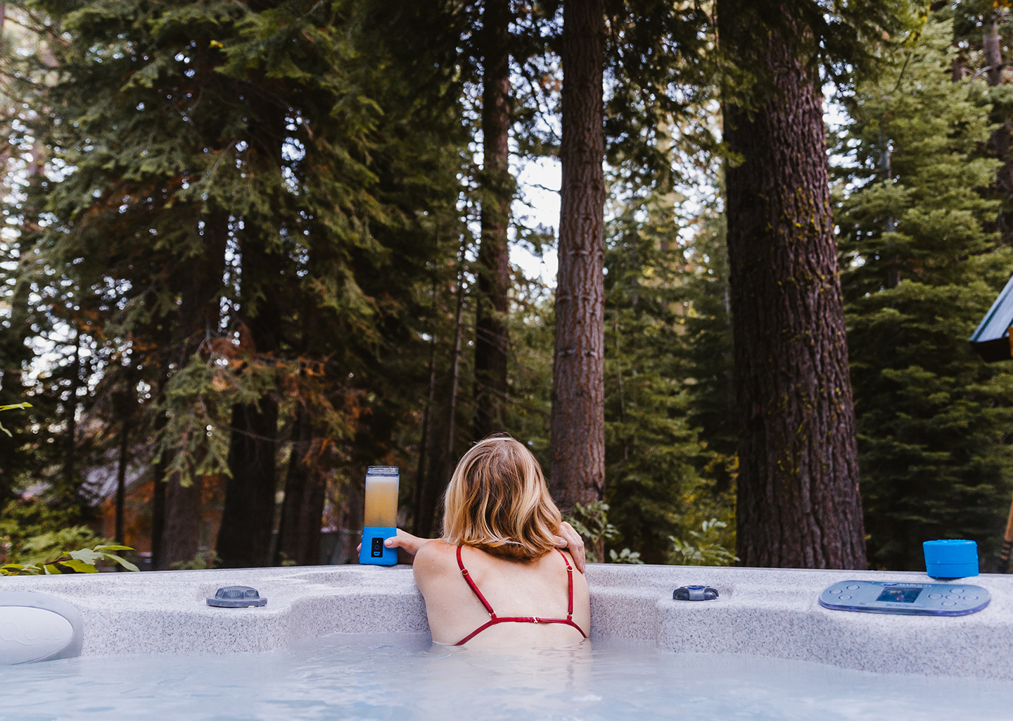 solo-hot-tub-in-the-forrest A Woman Stares into the Wilderness From Her Hot Tub
