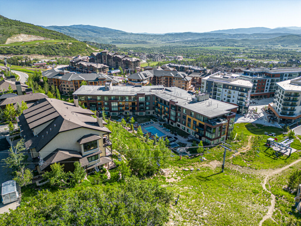 Lift drone exterior from the back side looking into Park City
