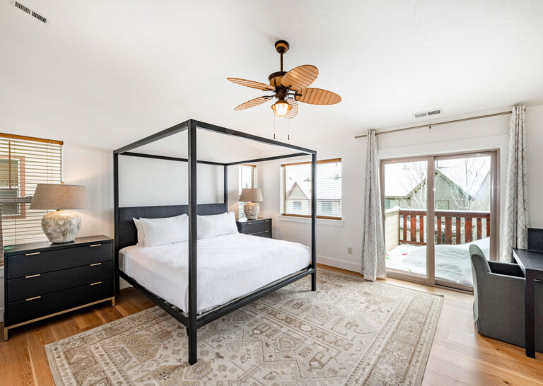 Primary suite bedroom with private balcony
