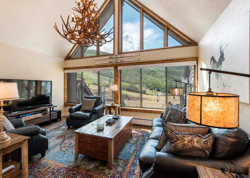 Living Room with Vaulted Ceilings and Deer Antler Chandelier at The Lodge at the Mountain Village