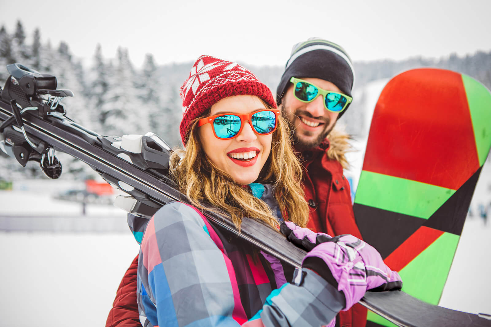 couple-snowboarding Couple in Park City, Utah enjoying skiing and snowboarding