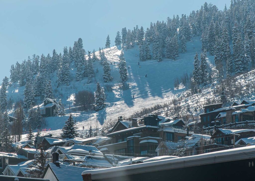 View of Skiers Coming Down Town Lift Run in Park City Utah