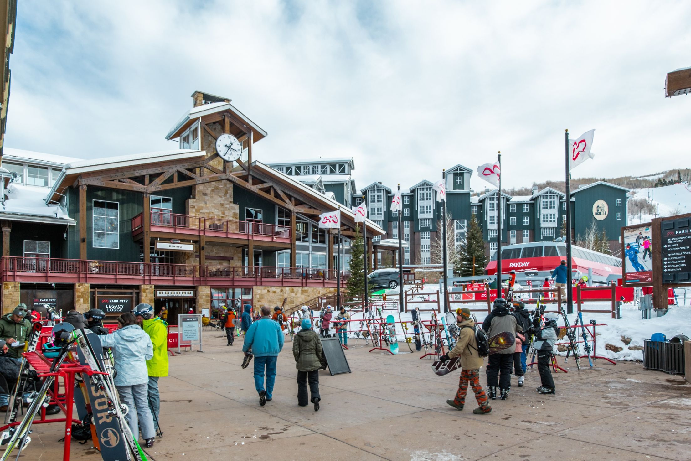 Skiers Walking Around Park City Base Area in Wintertime
