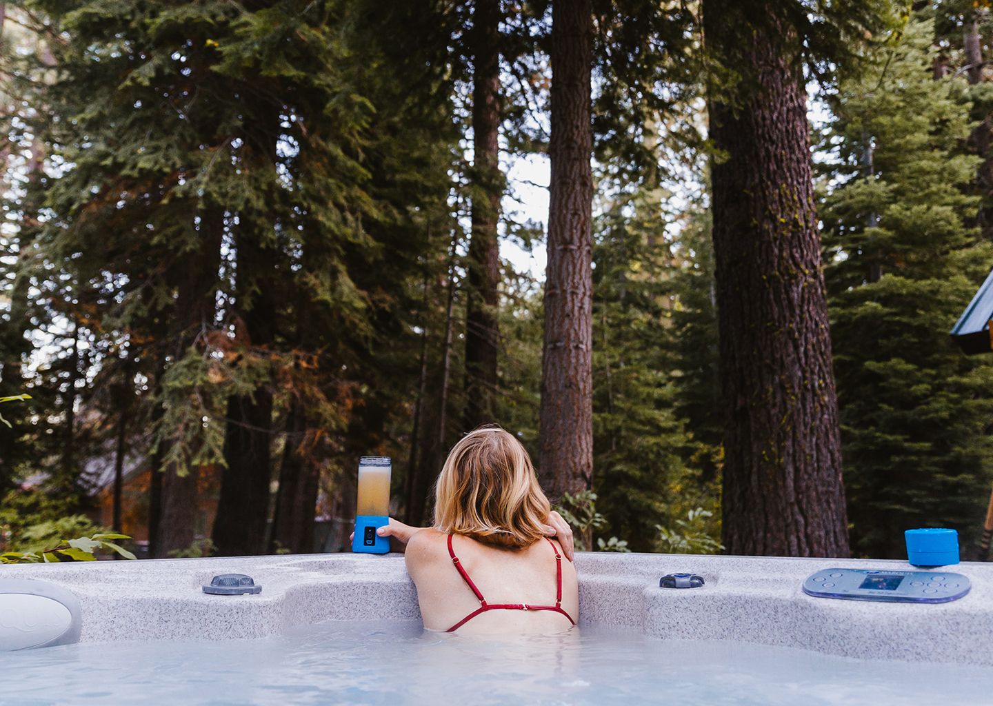 A Woman Stares into the Wilderness From Her Hot Tub