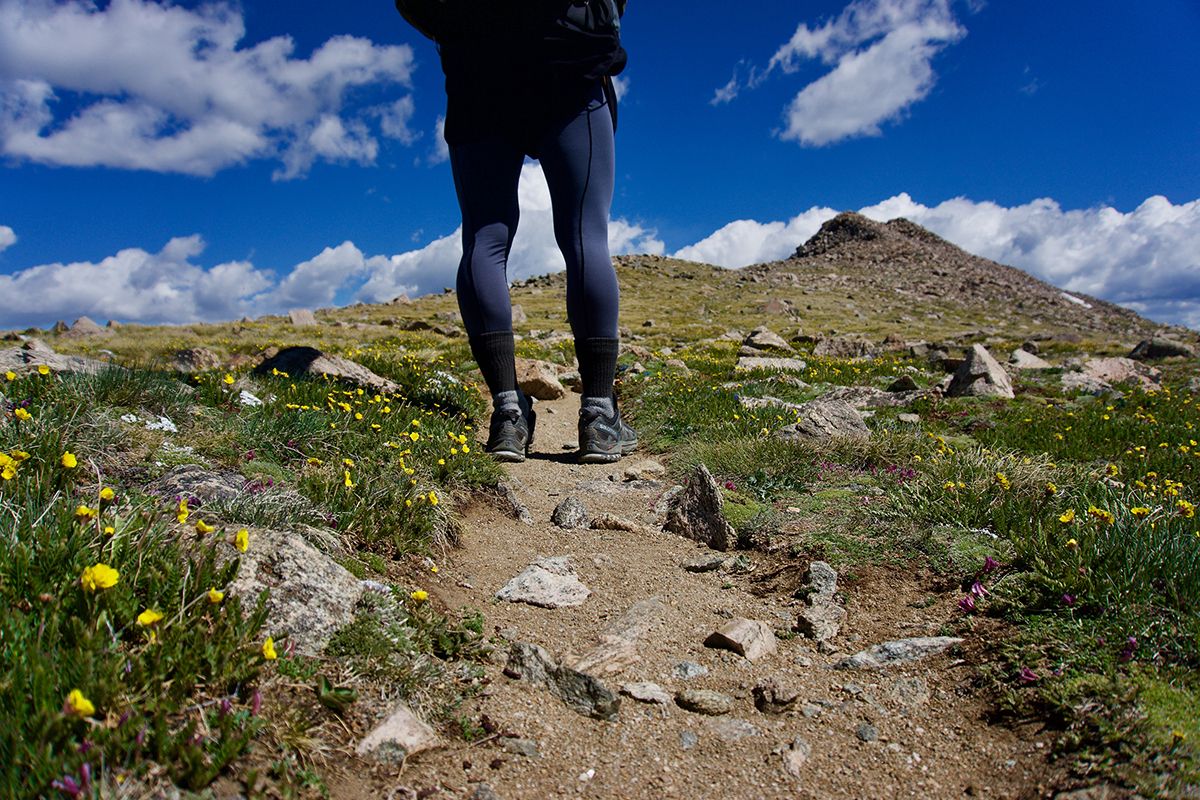 A Woman Enjoying A Hike on a Rocky Trail in Park City