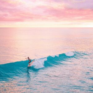 surfing longboard at pacific beach, ca