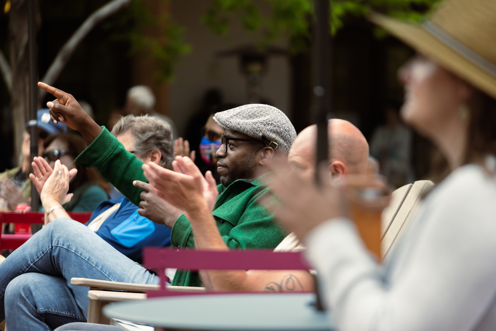 Raashan Ahmad cheers on young writers performing on a community stage at the 2023 Santa Fe International Literary Festival
